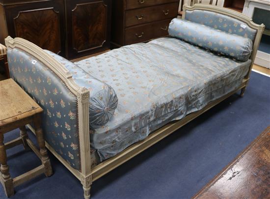 A French Louis XVI style cream painted day bed, L.200cm W.92cm